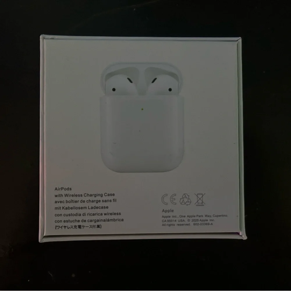 Apple AirPods with Wireless Charging Case - Classic White